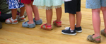 line of kids feet